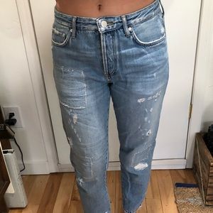 Free People distressed boyfriend jeans.